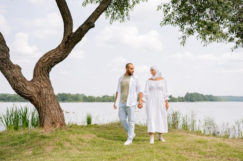 Couple Holding Hands by River