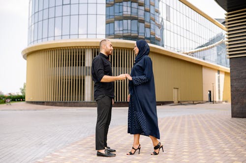 A Couple Standing in Front of a Building