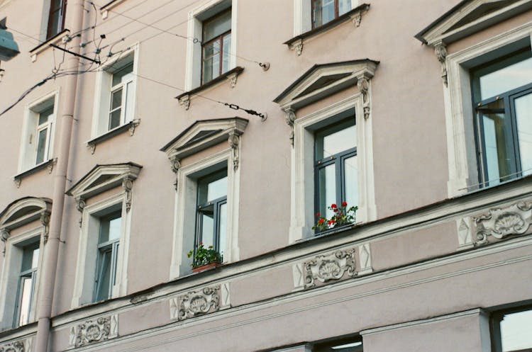 Facade Of A Tenement House With Details Around The Windows 