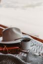 White Ceramic Mug on Brown Hat