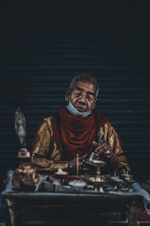 Old Man Selling Metalwork Outdoors