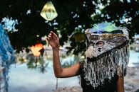 Person With Yellow and Blue Feather Headdress