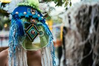 Woman in Blue Yellow and Green Floral Headdress