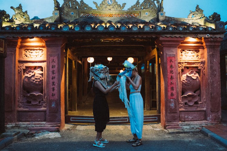 Women Wearing Decorated Masks