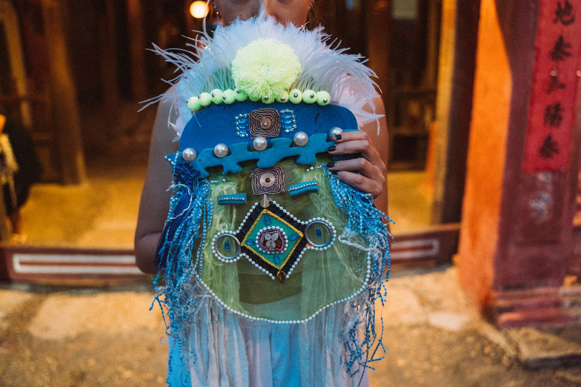 Close up of Woman Holding Decorated Mask