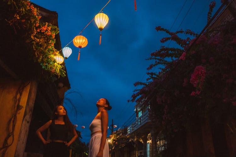 Girls Looking At The Hanging Lanterns