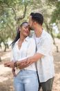 Man in White Button Up Shirt Kissing Woman in White Dress Shirt