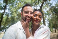 Man and Woman Smiling While Taking Selfie