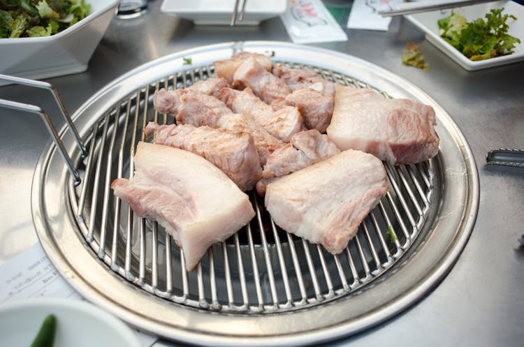 Raw Meat Lying On Grill