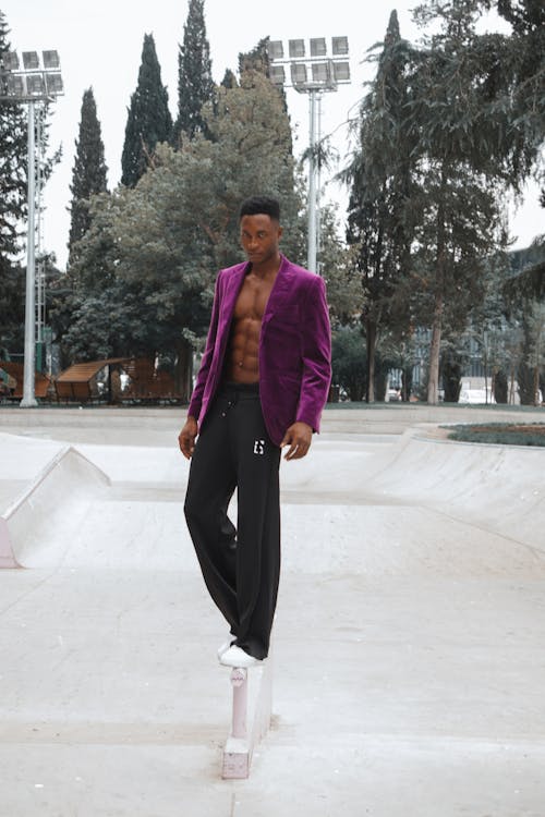 A Man in Purple Blazer with Six Pack Abs