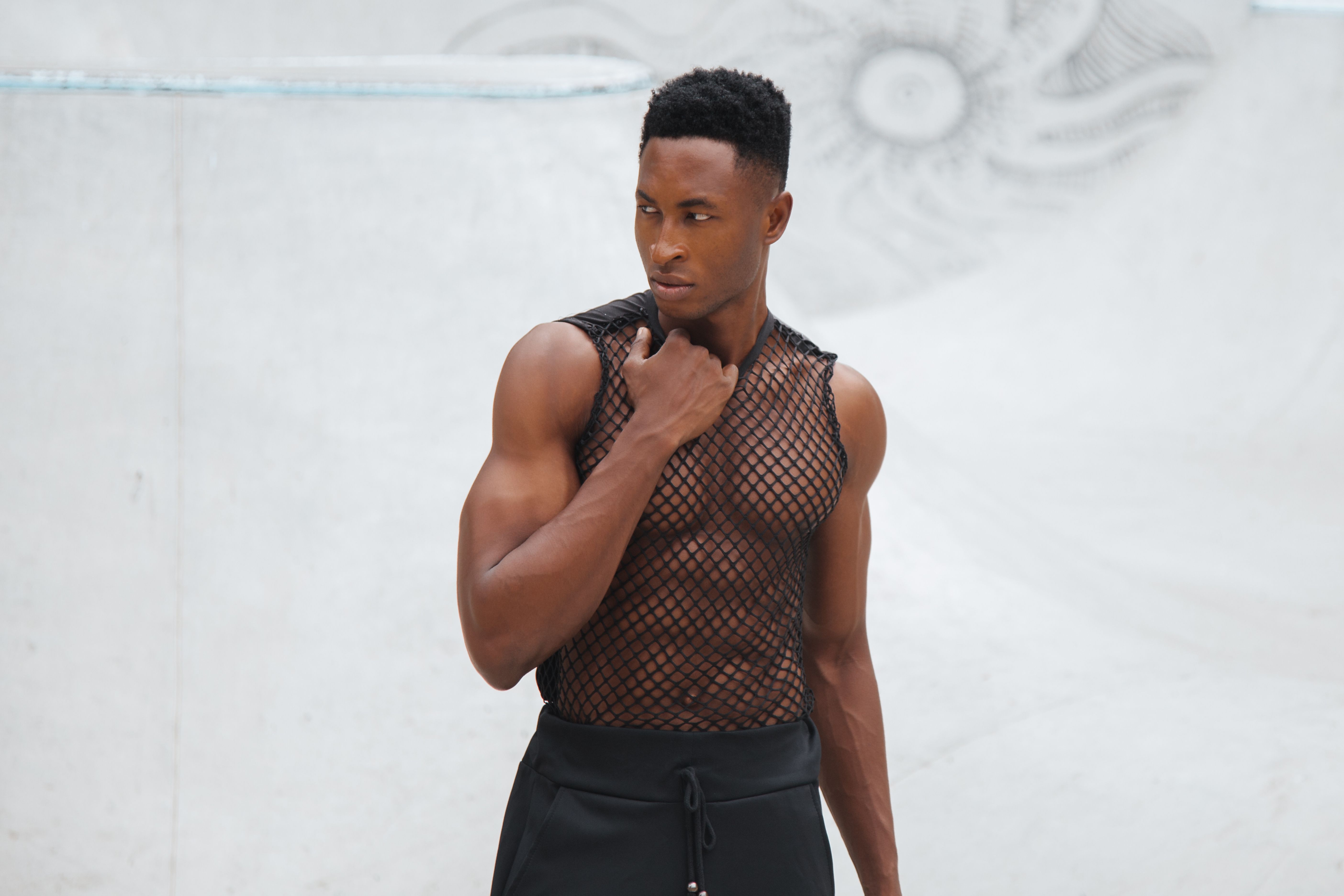 Man in Black Tank Top and Black Pants · Free Stock Photo