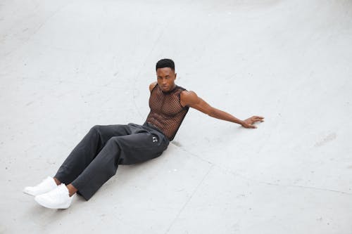 Man Wearing Black Clothes and White Sneakers