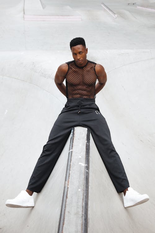 Stylish Man in Mesh Top and Black Pants 