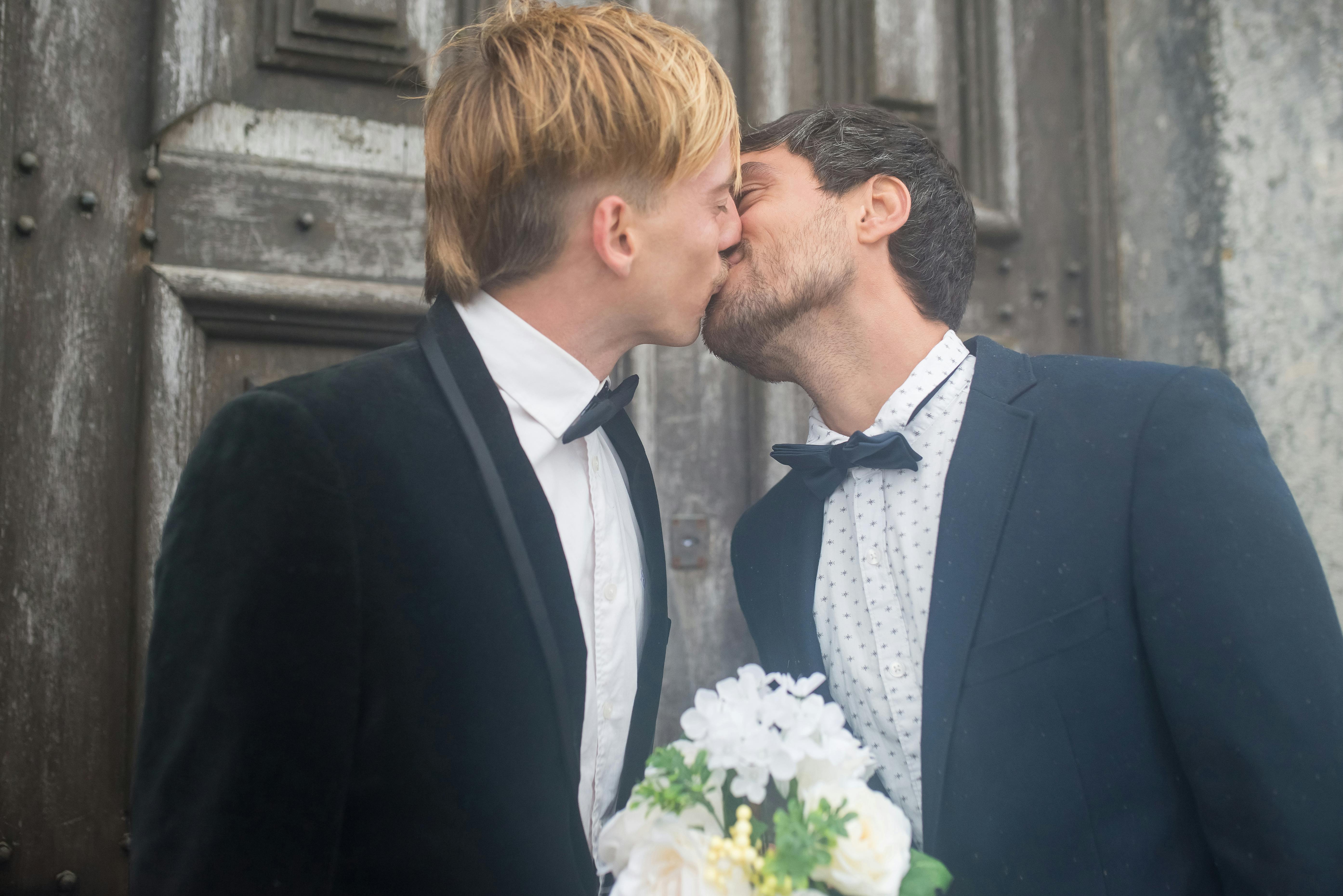 a newlywed couple kissing