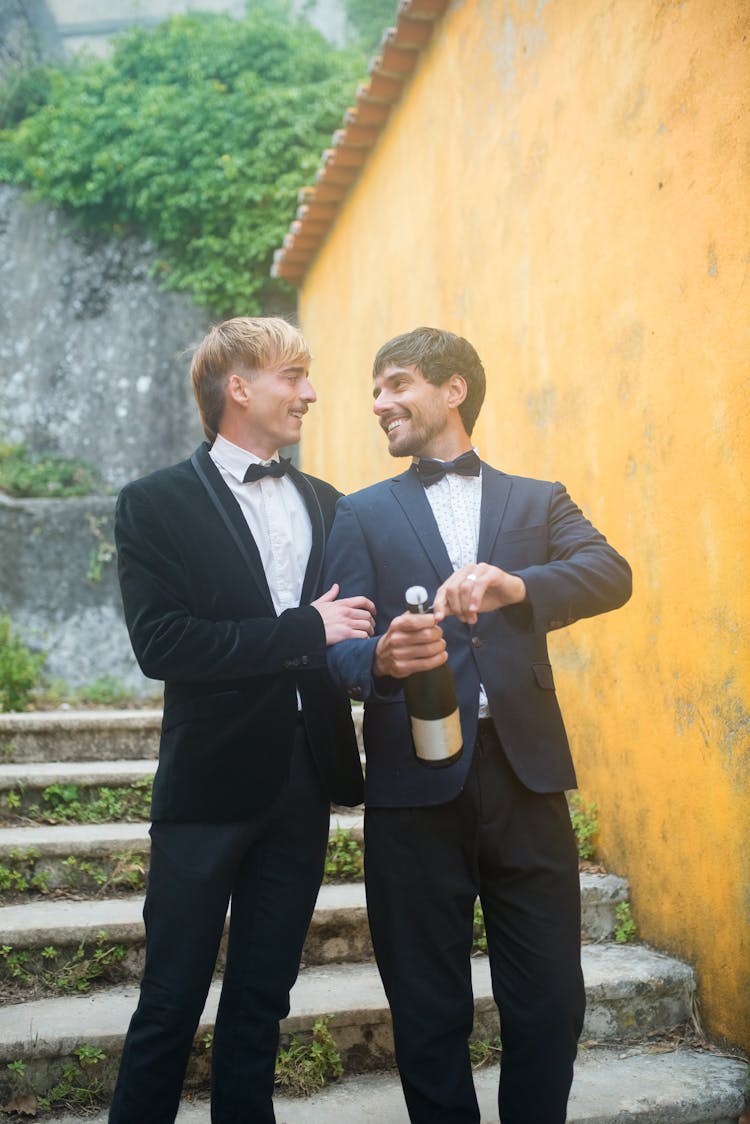 Men In Suits Standing On The Stairs