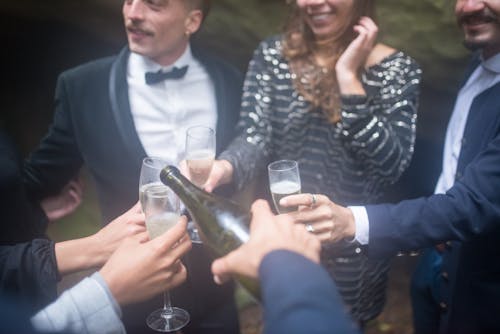 A Group of Friends Holding a Champagne Glasses