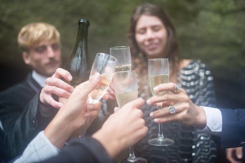 People holding Champagne Glass 
