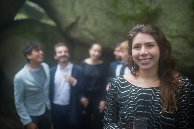 A Woman In Black Dress With Smiling Face