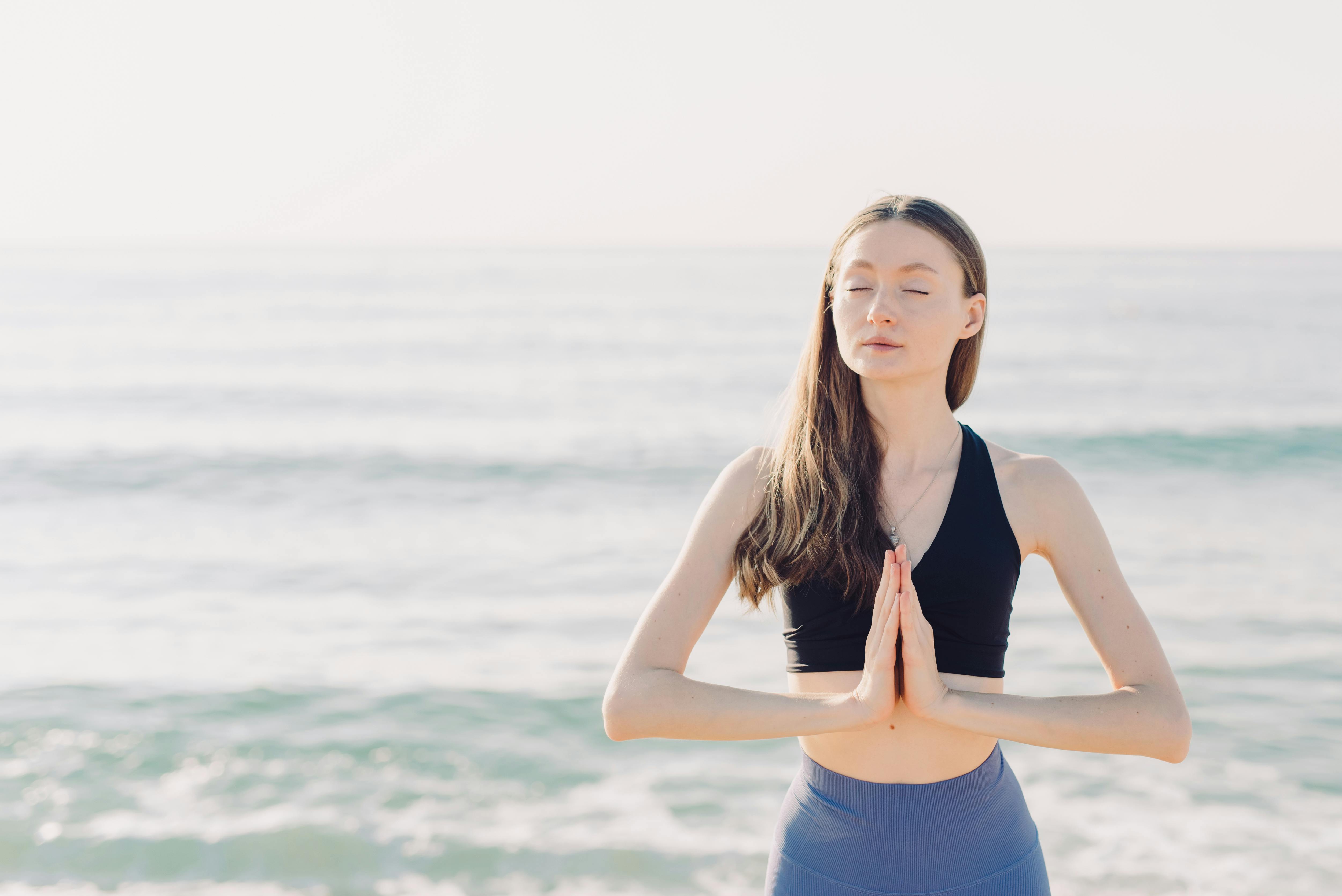 Woman on the Beach Wearing Black Tank Top · Free Stock Photo