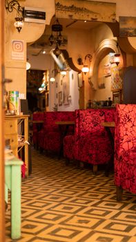 Explore this vibrant café in Istanbul, showcasing rich red decor and intricate design elements.