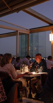 Intimate dining experience at a rooftop restaurant in Istanbul, capturing evening ambiance.