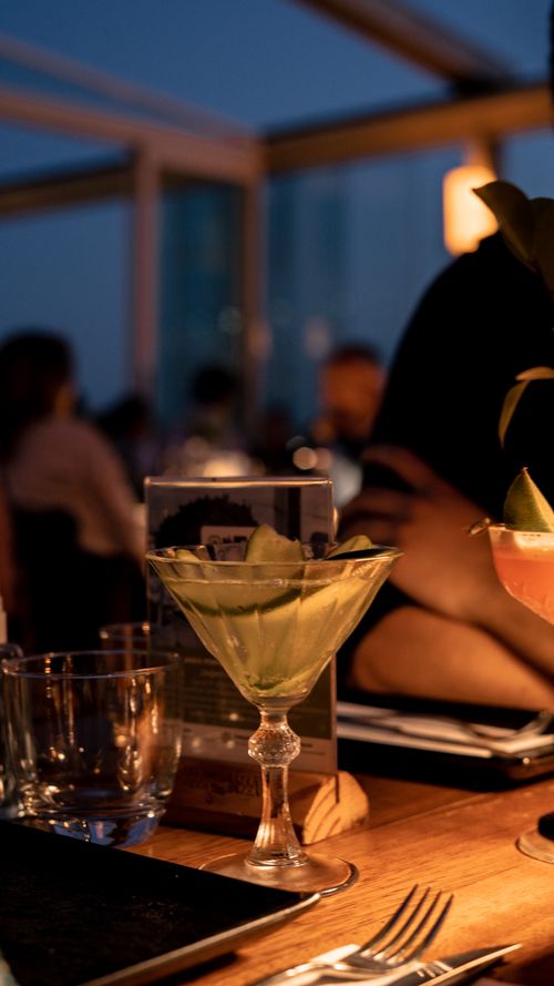 Free Elegant cocktail in an Istanbul rooftop lounge, an inviting setting for evening relaxation. Stock Photo