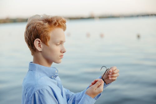 Teenager holding a Sharp Fishing Hook 