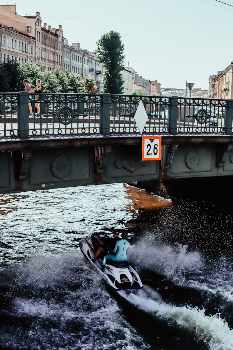 People Riding A Jetski