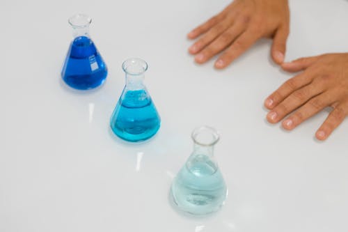 Erlenmeyer Flasks on White Table