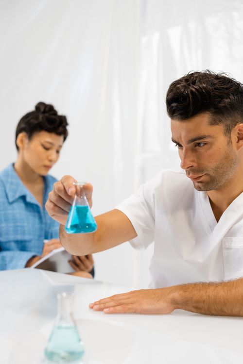 Free Two scientists working in a lab, focusing on chemical analysis for research purposes. Stock Photo