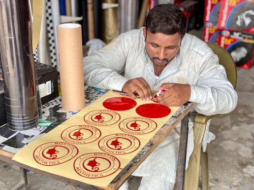 Man Crafting Handmade Stickers