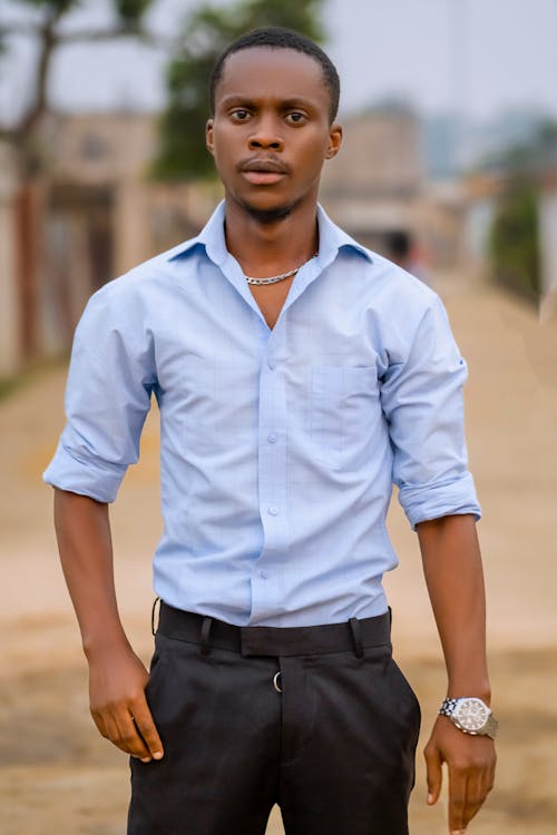 Man in Blue Long Sleeves and Black Pants