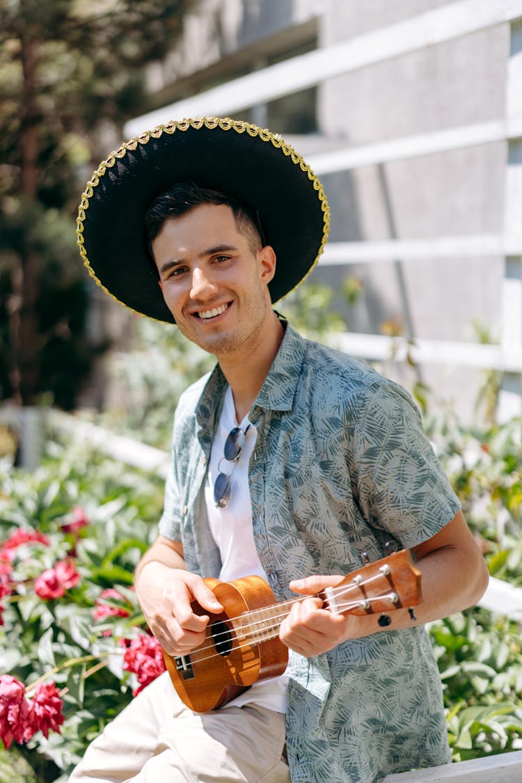 A Man Playing The Ukulele