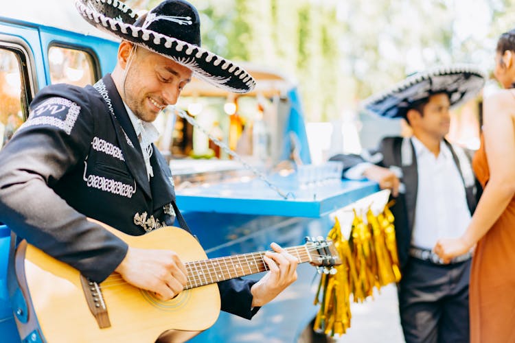 Mexican Musician Wearing Traditional Mariachi And Sombrero