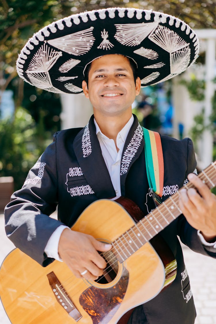 A Musician Wearing Mariachi And Sombrero