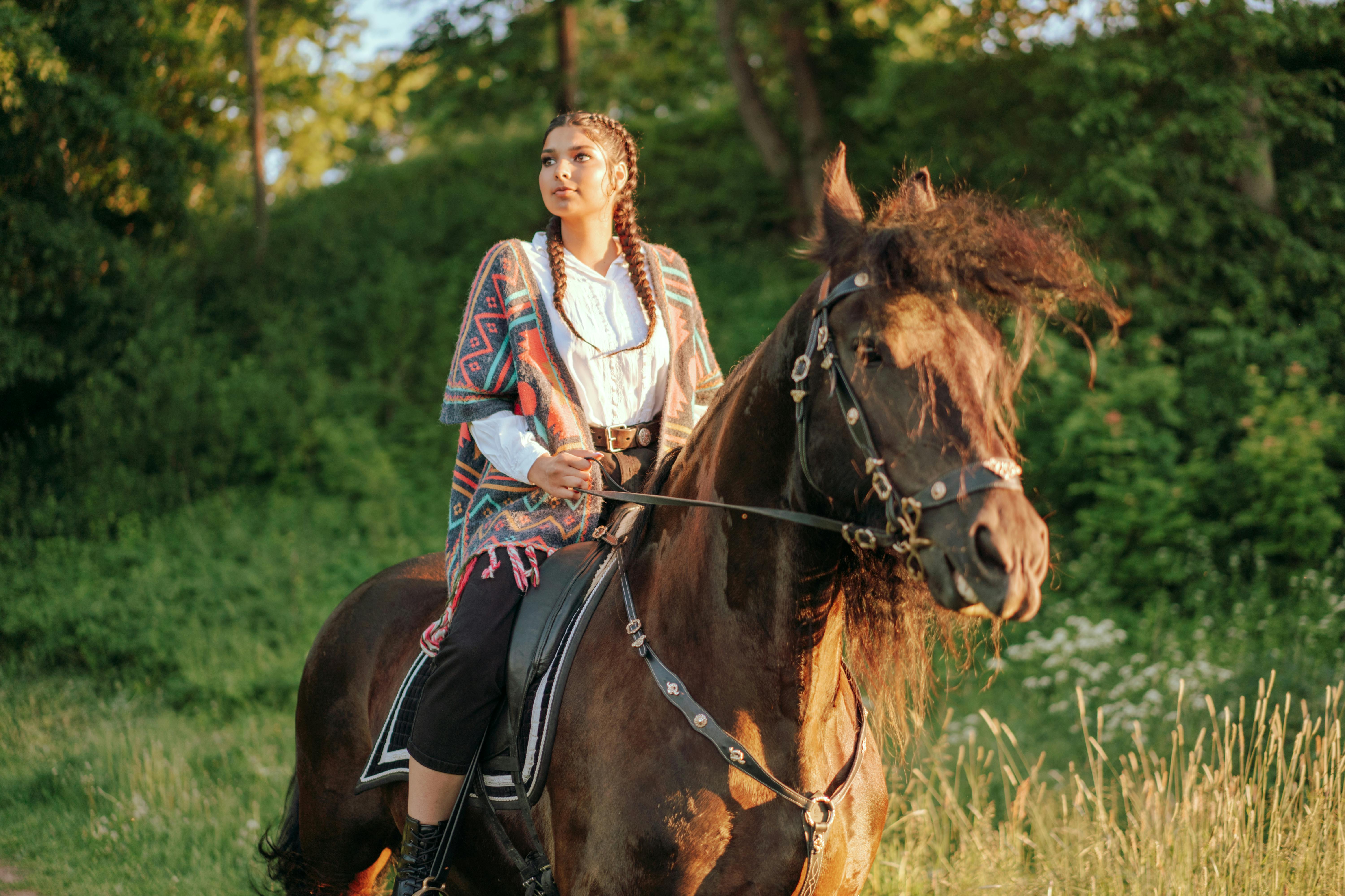 a woman riding a horse