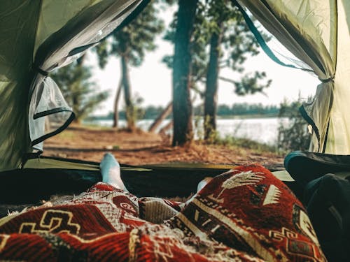 Free A Person Lying Down in a Tent Stock Photo