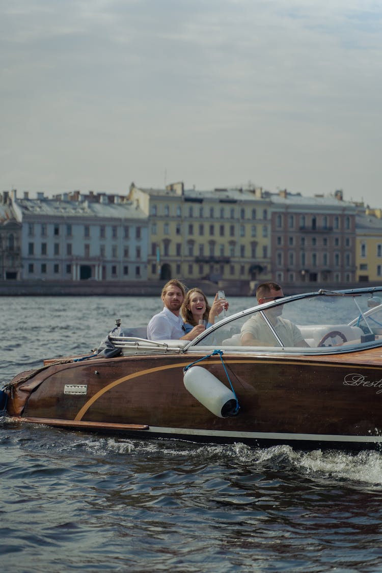 People Riding A Speedboat On Sea