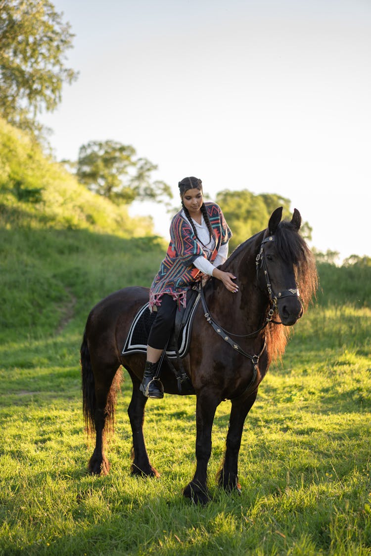 A Woman Petting A Horse 