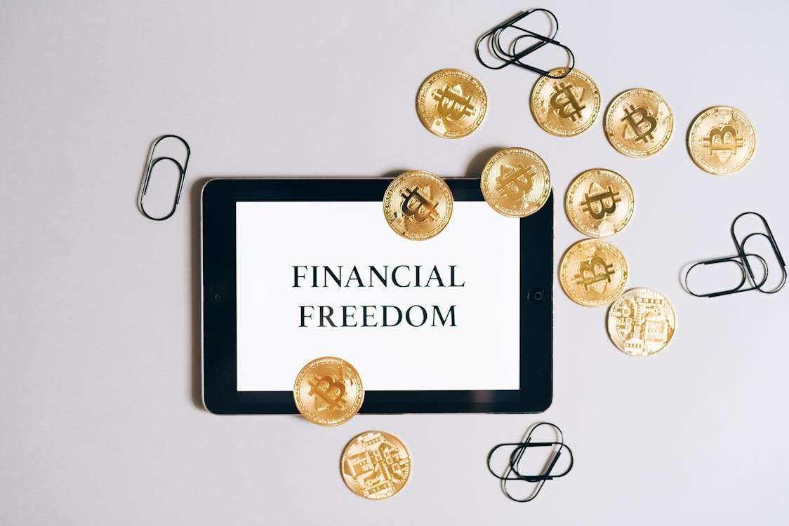 Free Overhead Shot of a Tablet and Bitcoins Stock Photo