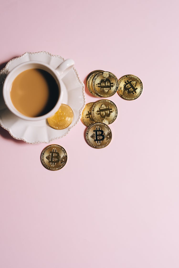 Gold Coins And A Cup Of Coffee 