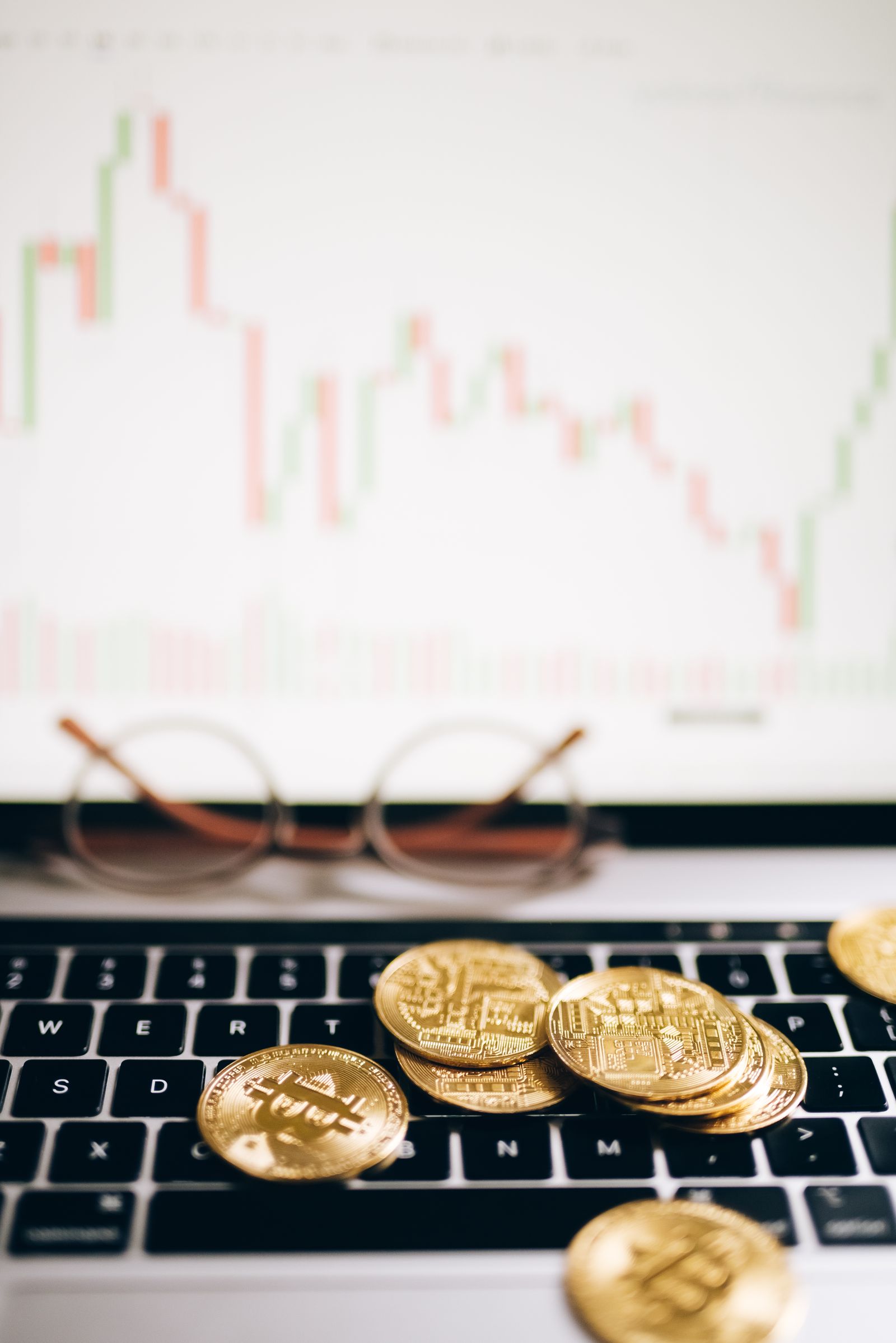 Bitcoin, currencies and financial charts during a market pullback