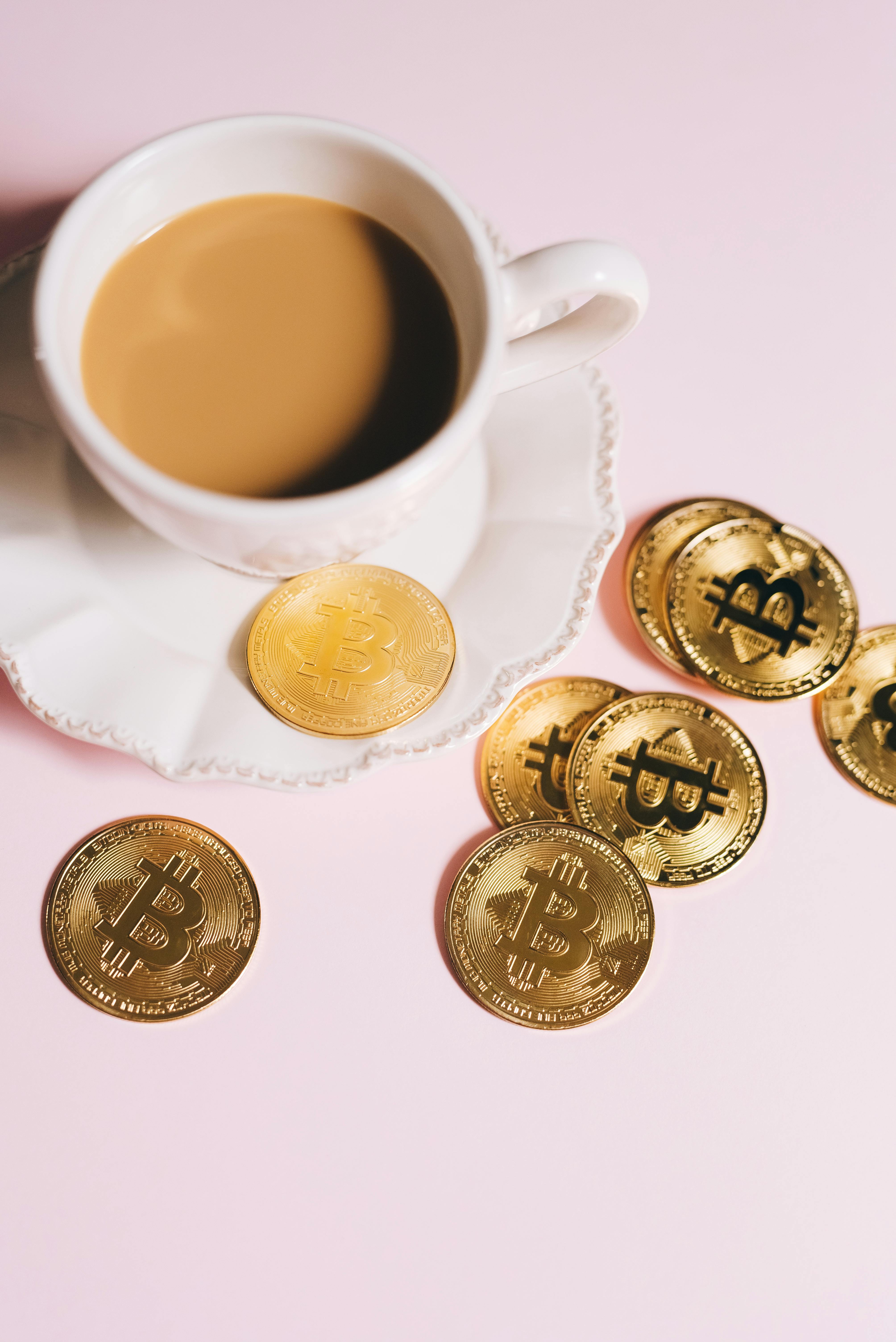 gold coins and a cup of coffee