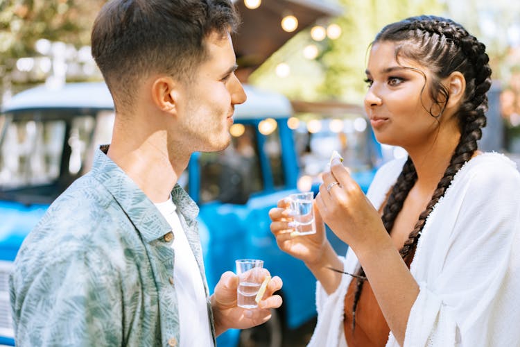 A Man And A Woman Drinking Tequila