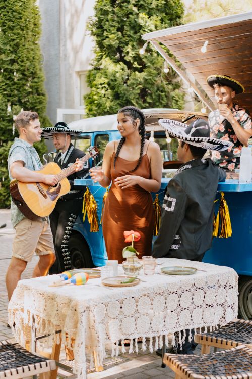 Free A lively group enjoying music and culture at an outdoor Mexican festival. Stock Photo