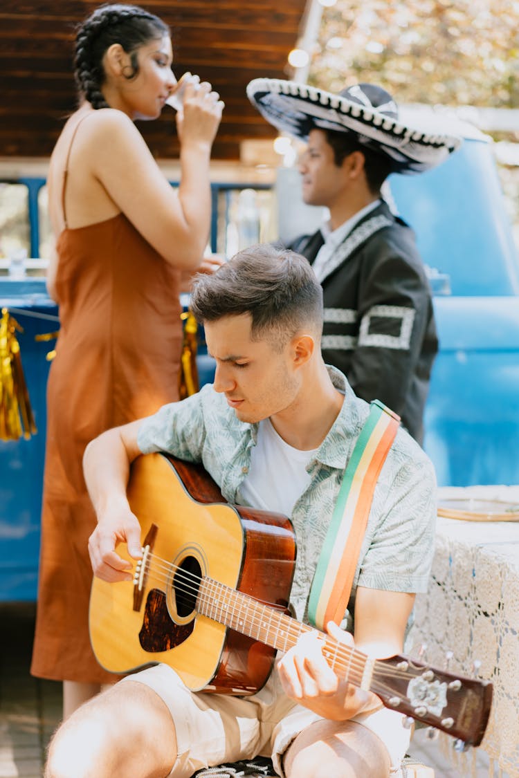 Man Playing The Guitar