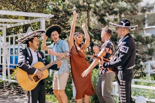 Free A Group of People Dancing to Mexican Music Stock Photo
