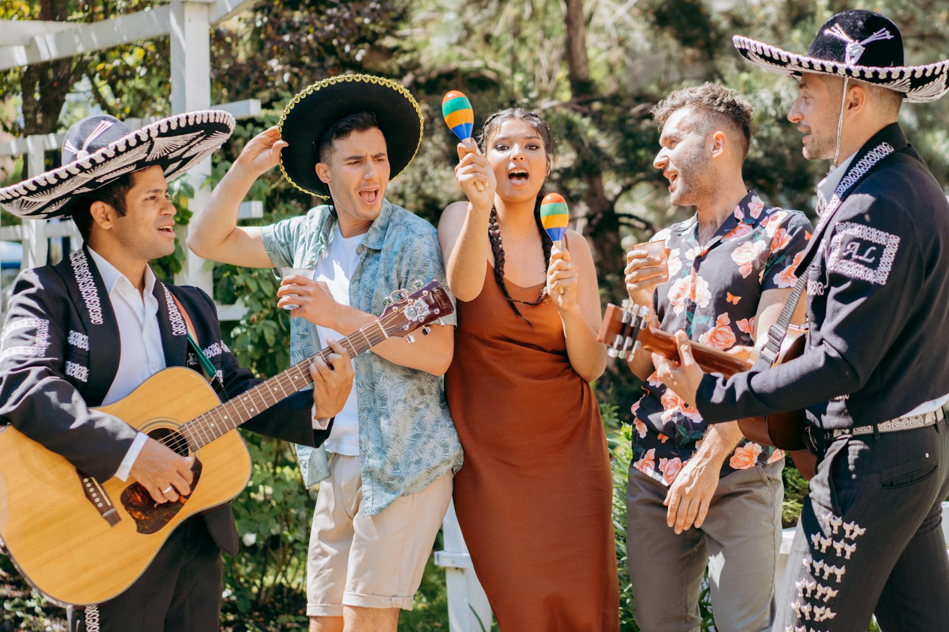 A Group of People Dancing to Mexican Music