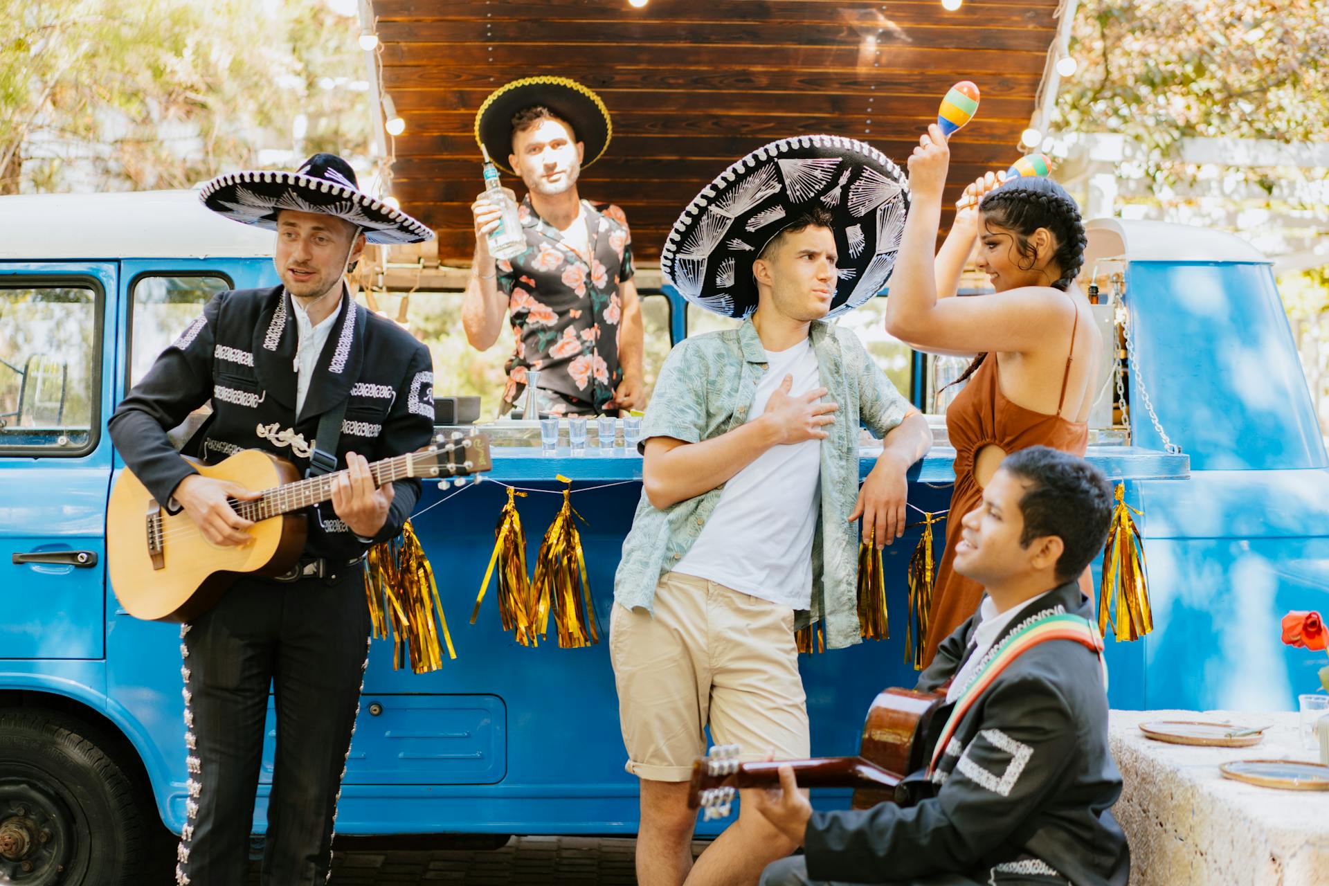 A Couple Partying Beside the Mobile Bar