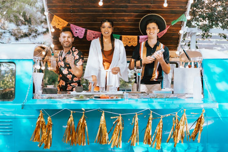 People Standing Inside The Mobile Bar